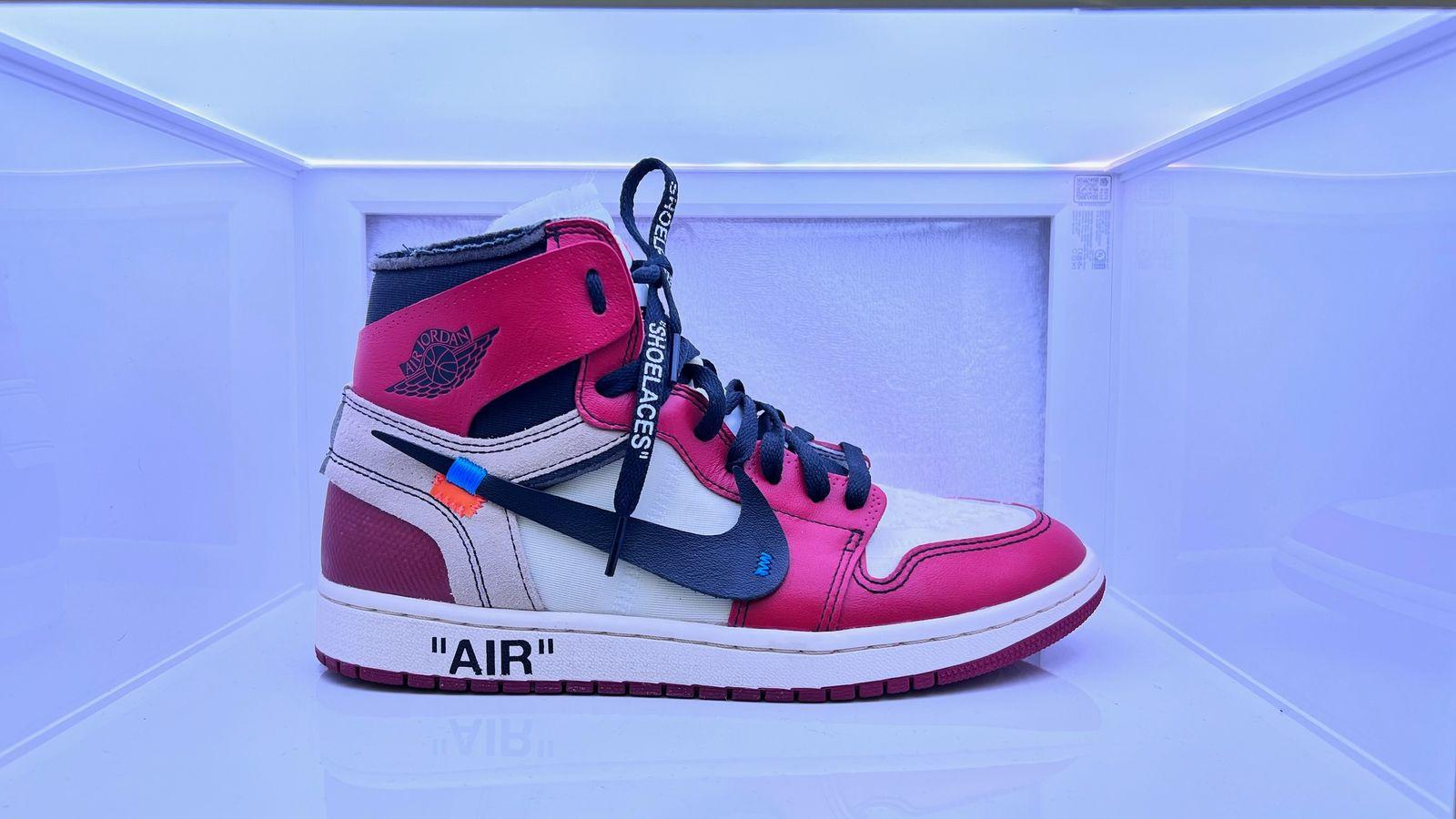 a pair of air jordans in a display case