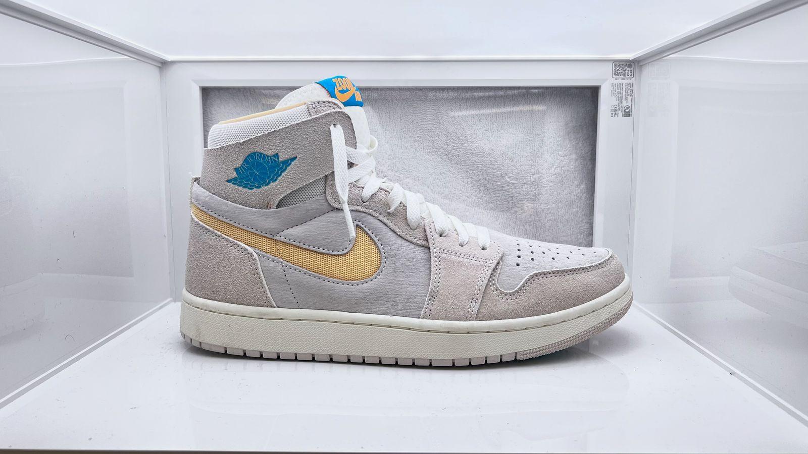 a pair of sneakers in a display case