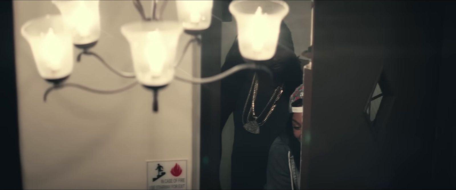 a woman standing in front of a mirror in a room