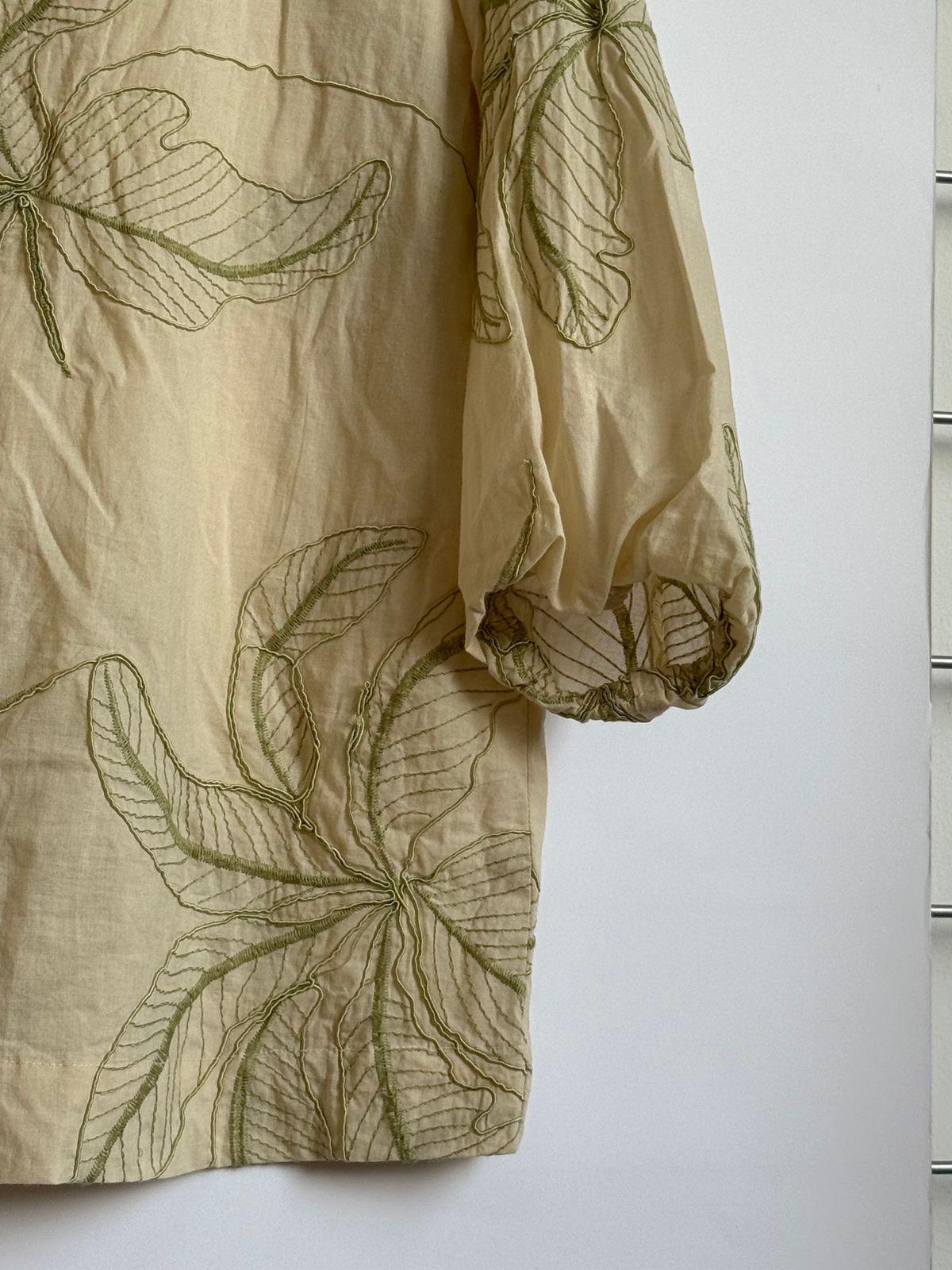 a close up of a shirt hanging on a wall
