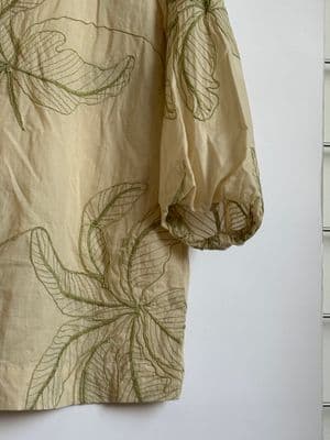 a close up of a shirt hanging on a wall