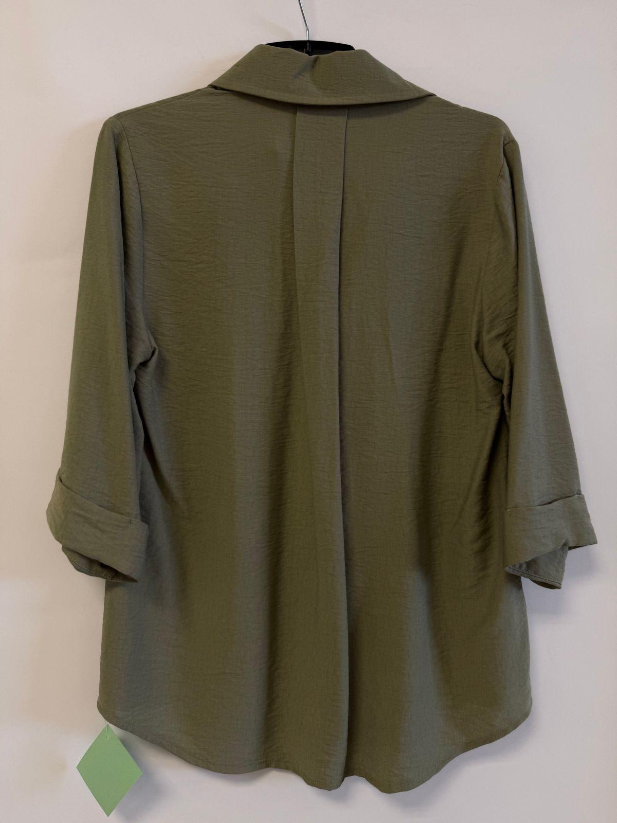 a green jacket hanging on a wall