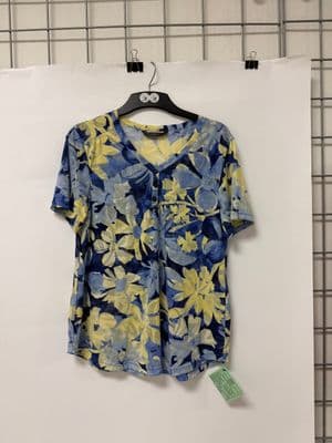 a blue and yellow shirt hanging on a wall