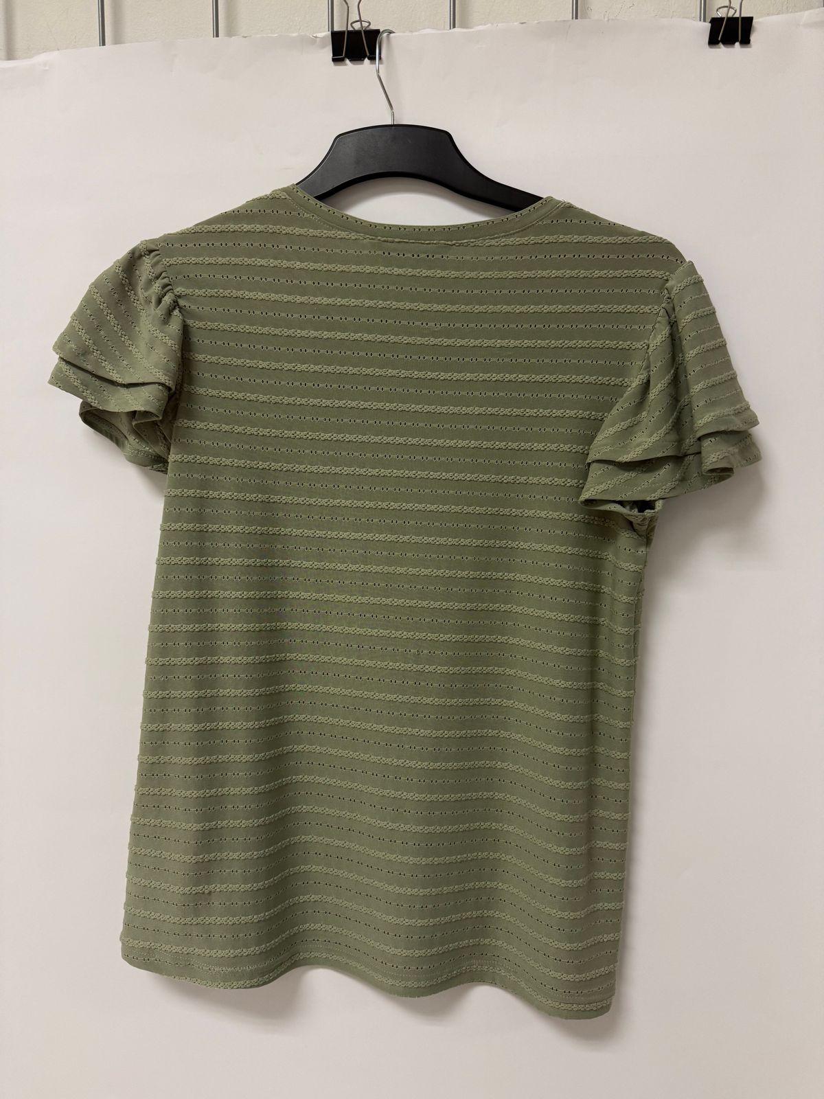 a t - shirt hanging on a clothes hanger
