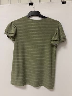 a t - shirt hanging on a clothes hanger
