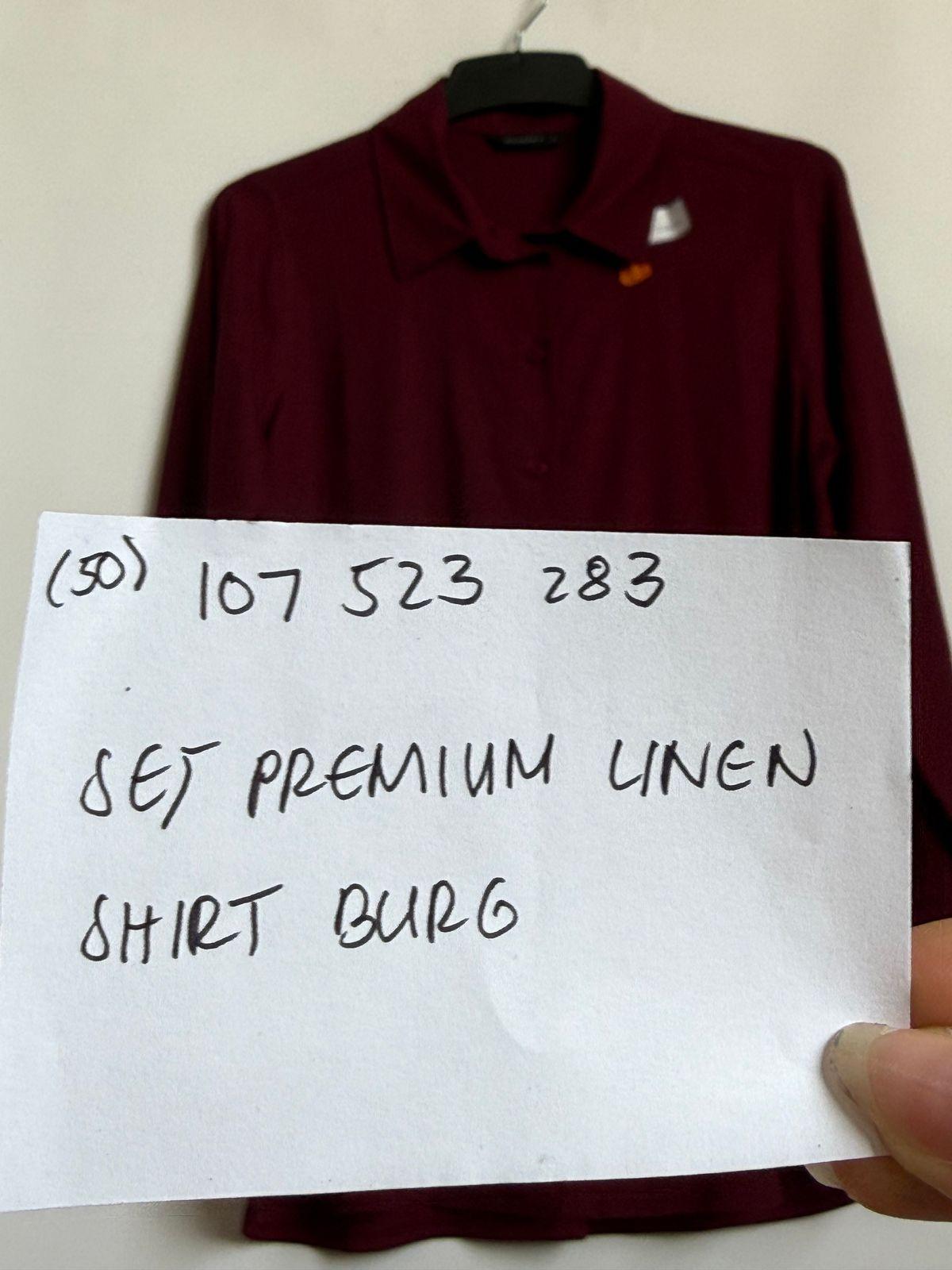 a hand holding a piece of paper with writing on it