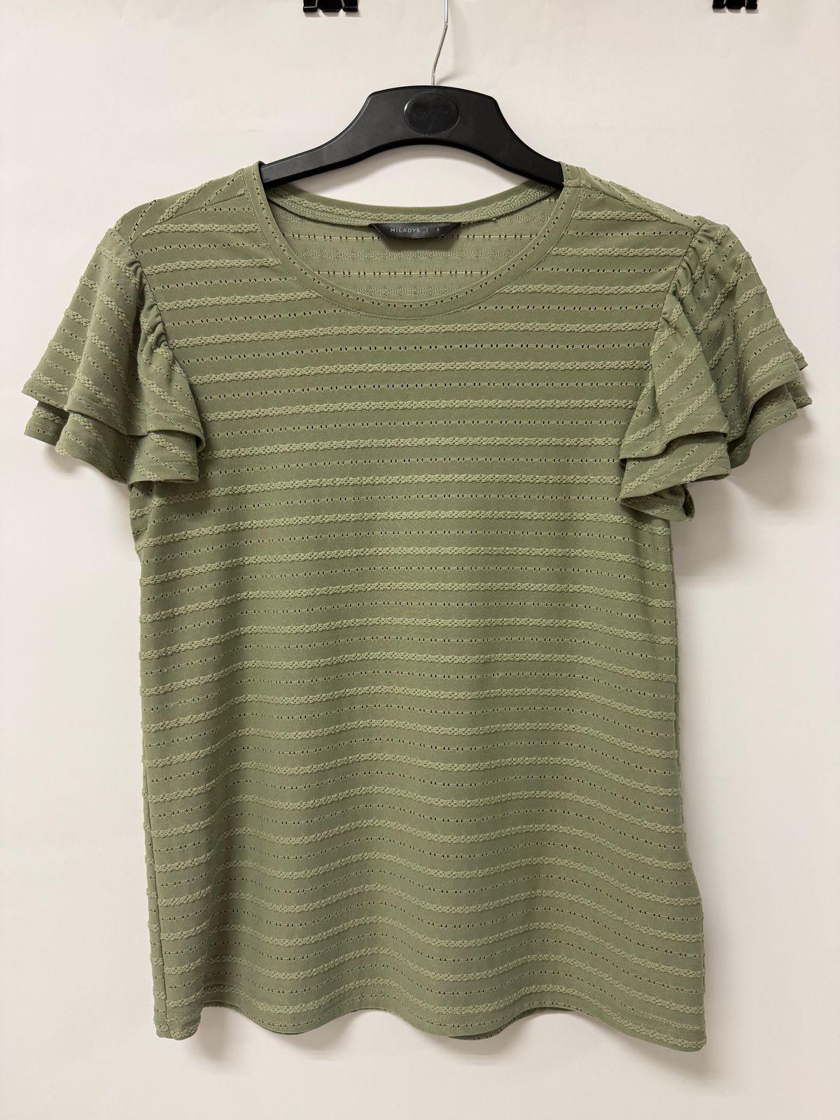a green shirt hanging on a hanger