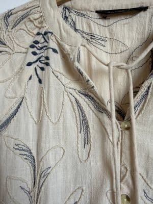 a close up of a shirt on a hanger