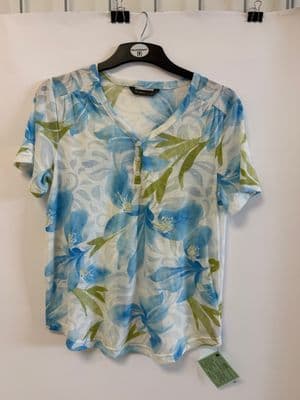 a blue and green shirt hanging on a wall