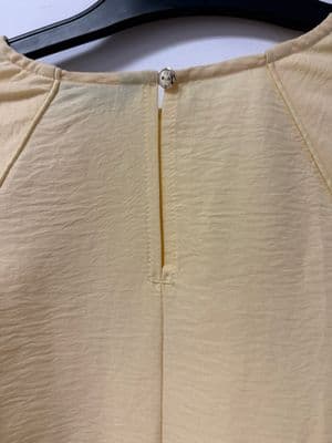 a close up of a piece of clothing on a hanger