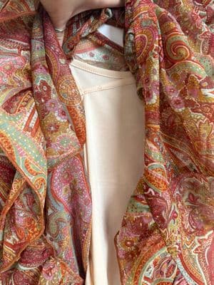 a close up of a person wearing a scarf
