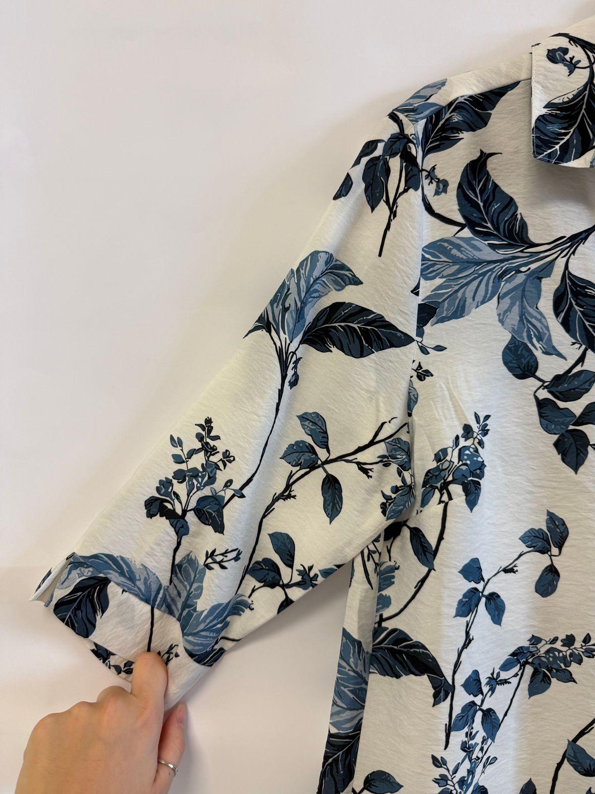 a person cutting a piece of fabric with scissors