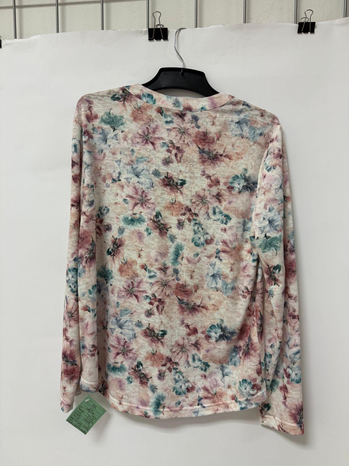 a floral shirt hanging on a hanger