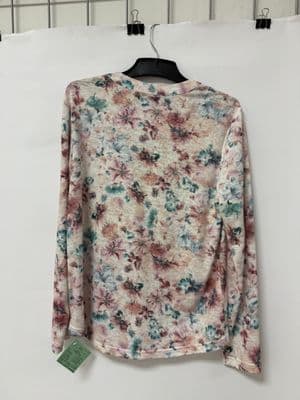 a floral shirt hanging on a hanger