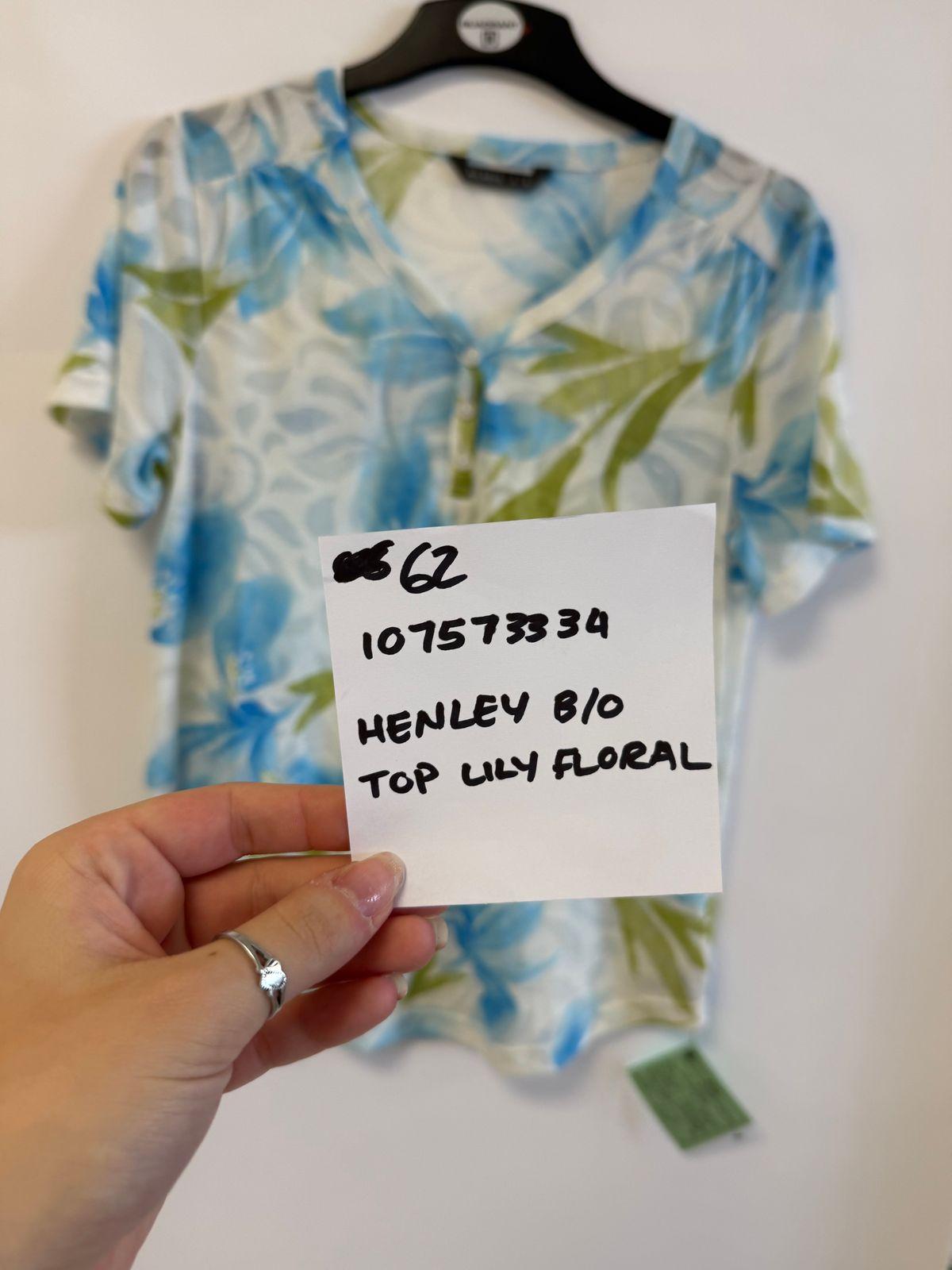 a person holding a piece of paper in front of a shirt