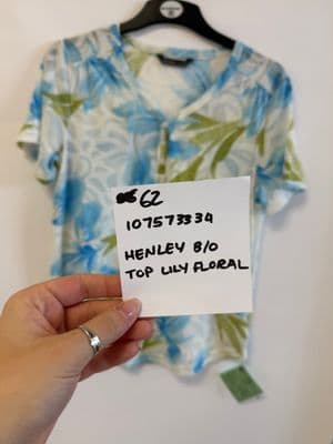 a person holding a piece of paper in front of a shirt