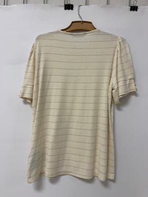 a white t - shirt hanging on a hanger