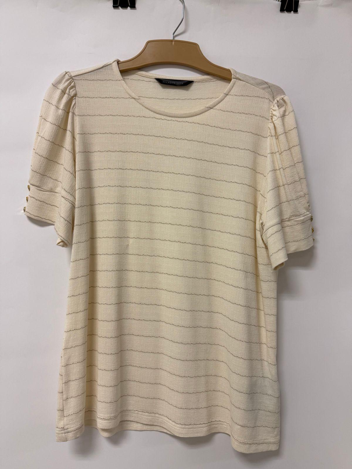 a white t - shirt hanging on a hanger
