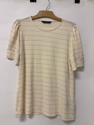 a white t - shirt hanging on a hanger