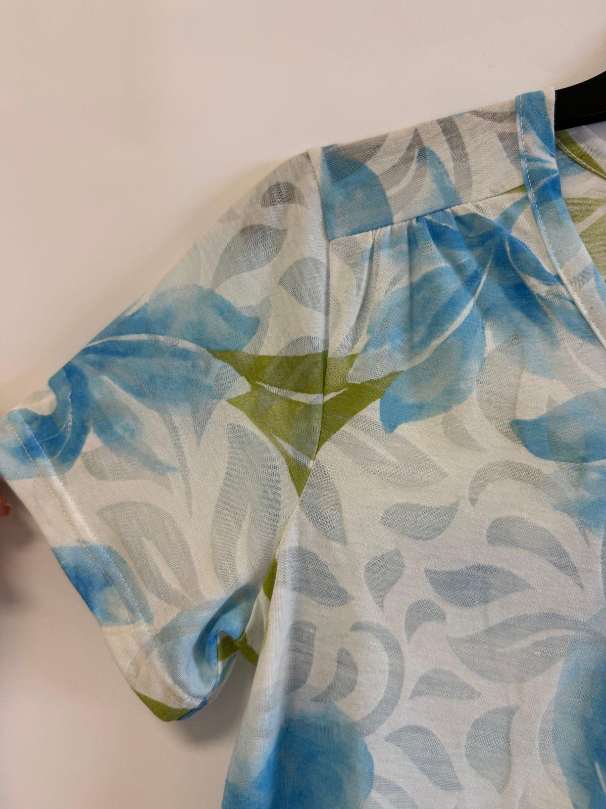 a person cutting a piece of fabric with scissors
