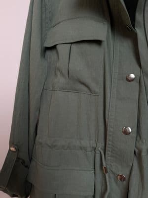 a green jacket with a hood and buttons on it
