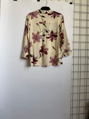 a shirt hanging up on a clothes rack