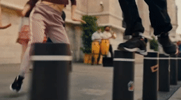 a couple of people that are jumping over some poles