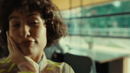 a woman with her hand on her face