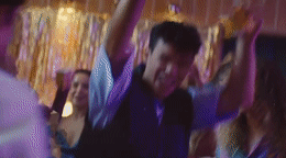 a group of people dancing at a party