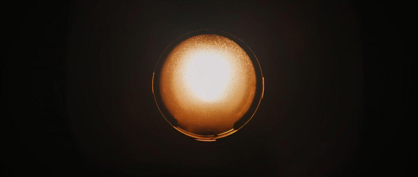 a close up of a light bulb in the dark