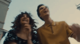 a couple of people standing next to each other