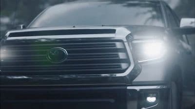 a close up of the front of a black truck