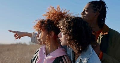 a group of young women standing next to each other