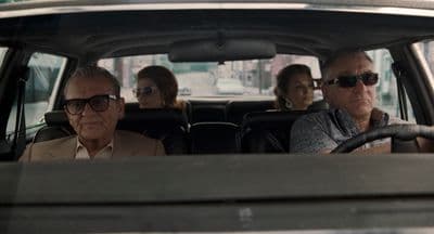 a group of people riding in a car