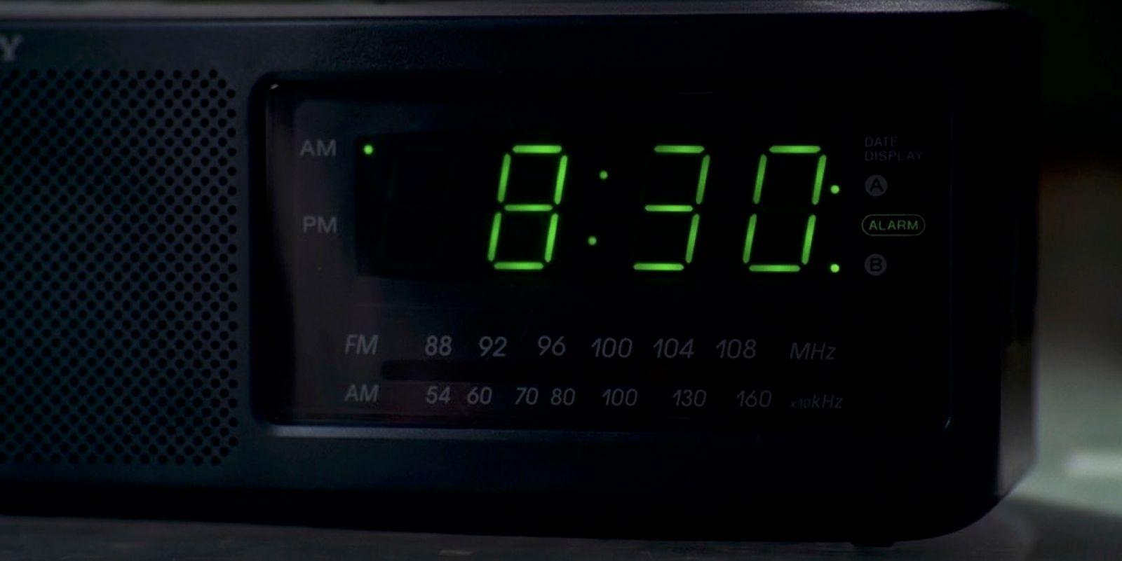 a digital clock displaying the time on a table