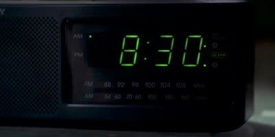 a digital clock displaying the time on a table
