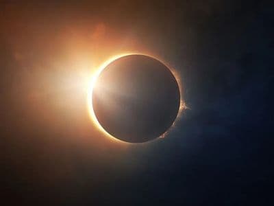 a solar eclipse is seen in the sky