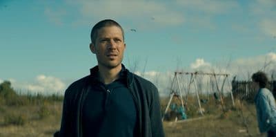 a man standing in front of a playground