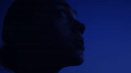 a close up of a person's face in the dark