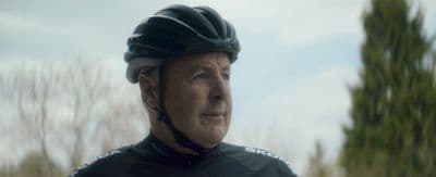 a close up of a person wearing a bike helmet