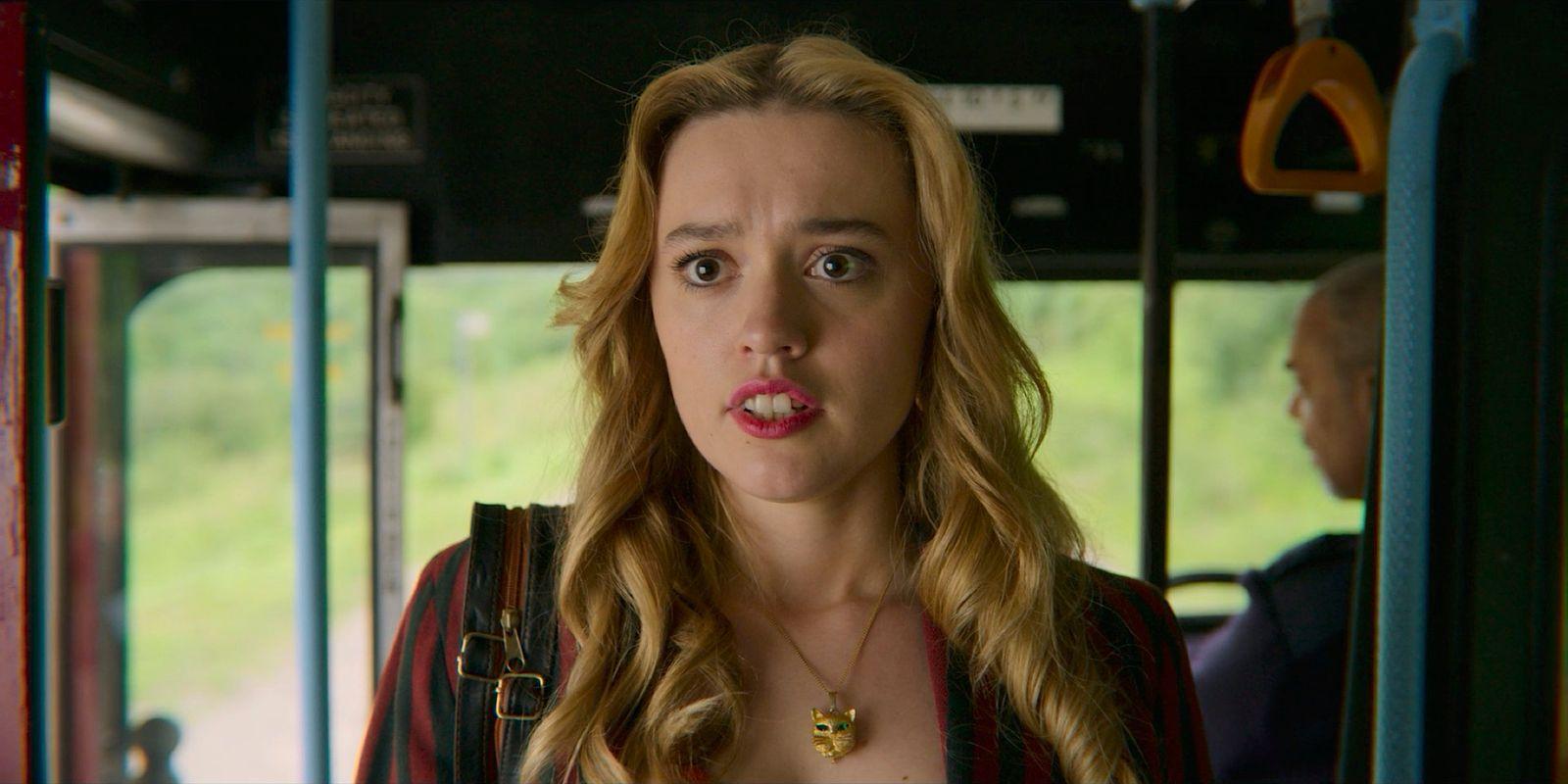 a woman sticking out her tongue on a bus