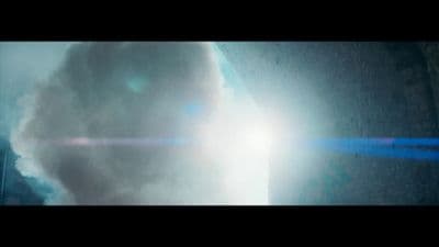 a very large cloud with a bright light coming out of it