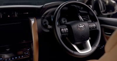 a steering wheel and dashboard of a car