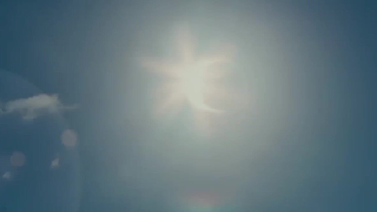 the sun is shining brightly in the blue sky