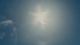 the sun is shining brightly in the blue sky