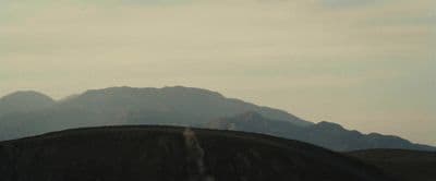 a view of a mountain range from a distance