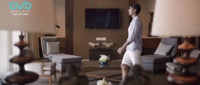 a man is walking through a living room