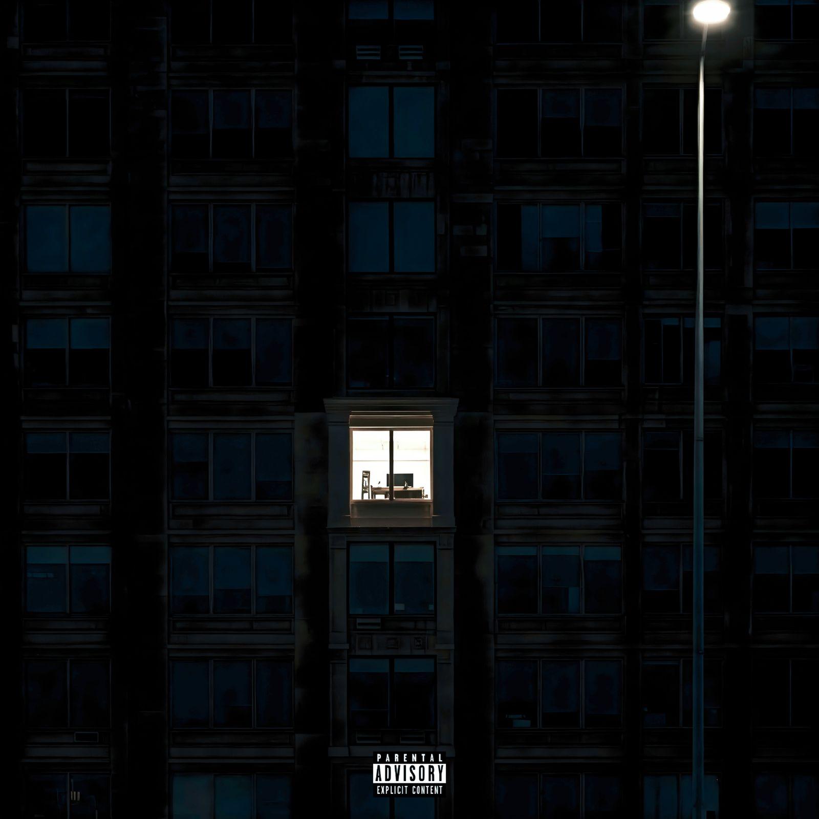 a man standing in a window of a tall building