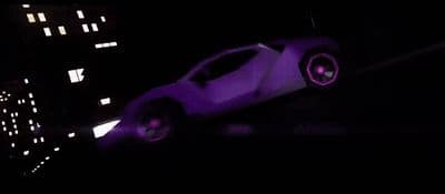 a futuristic car is shown in the dark