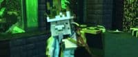 a minecraft character standing in front of a computer screen